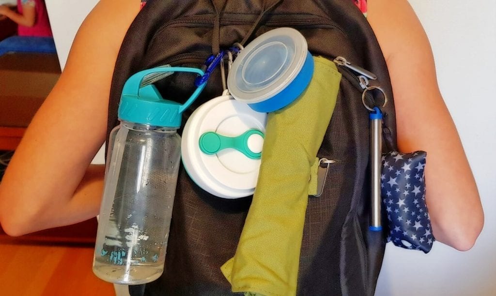 Plastic-free travel eco friendly gadgets attached to backpack